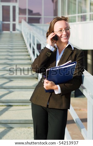 Businesswoman on the phone at airport.