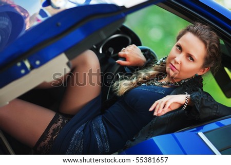 Young woman in a sports car.