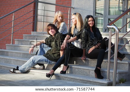 Young people relaxing on the steps