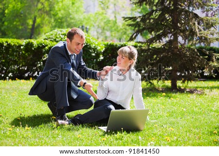 Young business people using laptop
