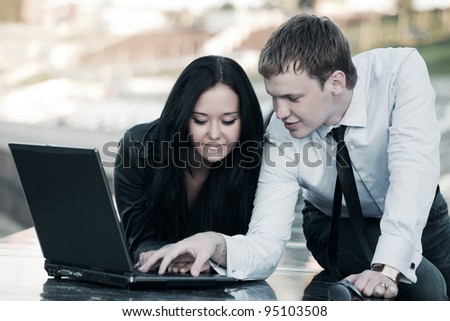 Young people using laptop