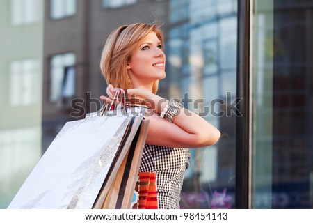 Happy young woman shopping