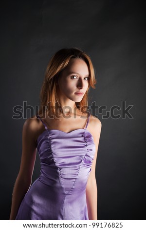 Young woman in a lilac dress