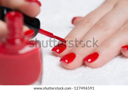 Manicure - Beautiful Manicured Woman\'S Nails With Red Nail Polish On Soft White Towel.