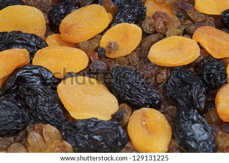 Mixed Dry Fruit - Close up shot of dry fruit: dry apricots, prunes and raisins.