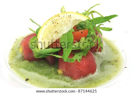 Tuna mango salsa topped with mint sherbet on top with lemon and rocket
