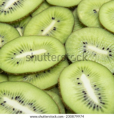 Tropic fruity food, background. Slice of fresh kiwi