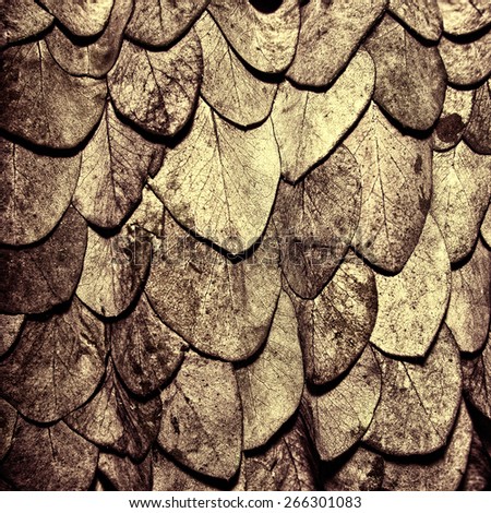 Bronze leaves background in the form of scales of a snake