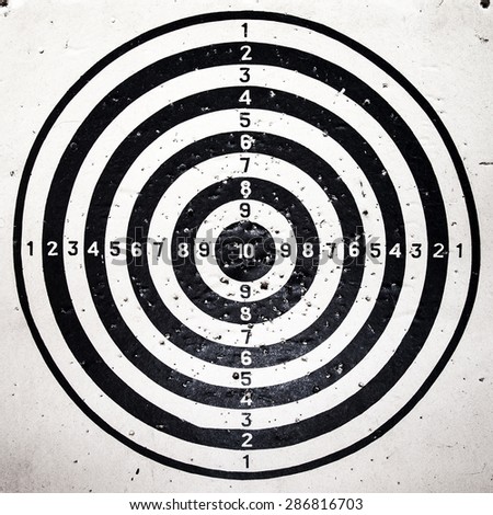 Bull eye target with bullets holes