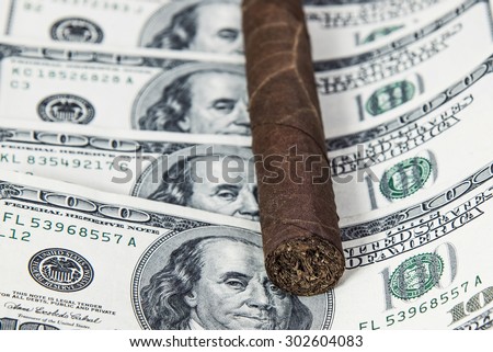 Cuban cigar on the hundred Dollars bills