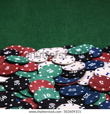 Casino chips on a green table background