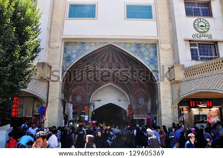 TEHRAN, IRAN - CIRCA AUGUST 2012: Iranians entering the Grand Bazaar in Tehran through the main gate circa August 2012. Grand Bazaar in Tehran is the bigest bazaar in Iran.