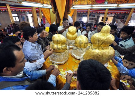 INLE LAKE, MYANMAR - CIRCA NOVEMBER 2014: Many years of devotees adding small pieces of gold leaf has turned small buddha statues into amorphous blobs circa November 2014 in Inle Lake, Myanmar.