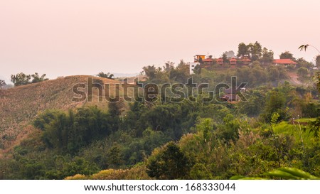 house on a green hill