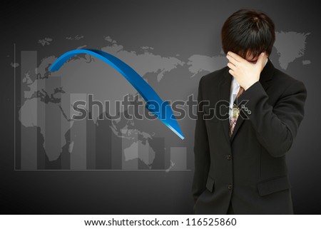 Stressed businessman with low financial graph of global business