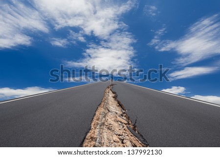 Cracked road with motion cloud background