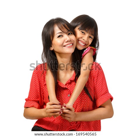 Happy mother and daughter sitting Isolated over white Happy mother and daughter sitting Isolated over white