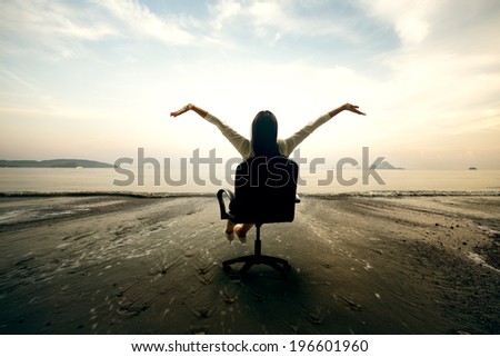 Relaxing business woman sitting on beach, Success in business concept