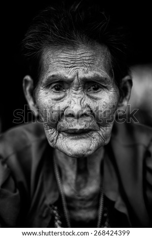 Close up face of old asian woman with wrinkles elderly senior, Black & White color tone
