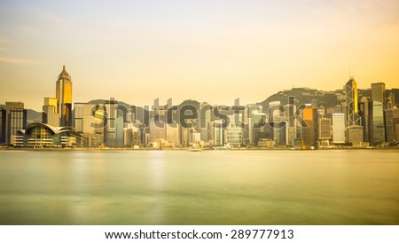 Hong kong city skyline at night over victoria harbor with clear sky and urban skyscrapers