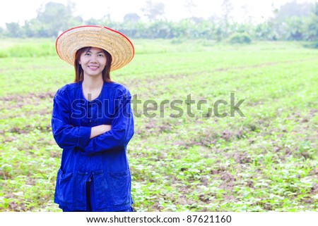 Young woman in farmer suite