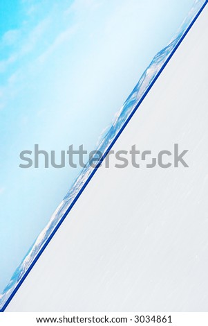 an ocean water horizon with a blue sky from an unusual angle