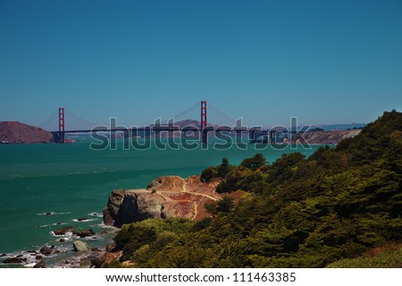 Golden Gate Bridge and coastline with wild nature of California