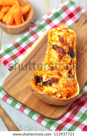 Sliced butternut squash with filling baked with cheese