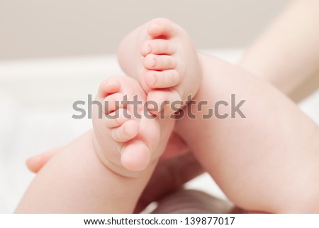 cute soft baby feet close up