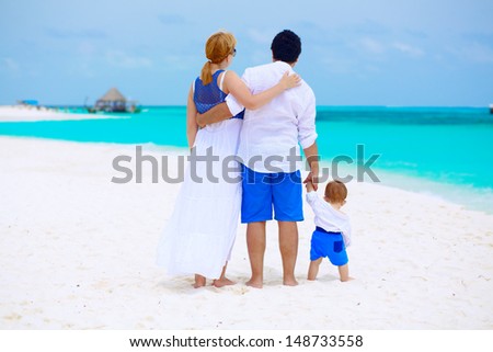 Family of three having tropical vacation at Maldives