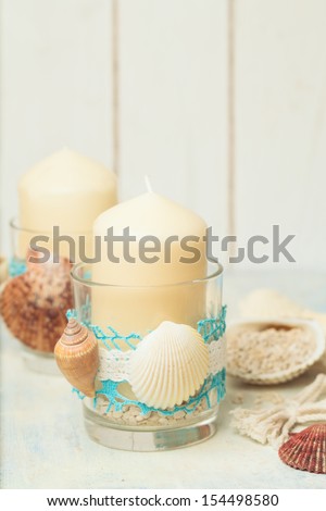 Handmade decoration with candles in marine style.