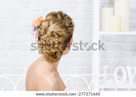 Bridal hairstyle with flowers accessory
