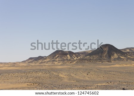Black desert, Oasis area, Egypt. Black rock was created by the volcanic activity long time ago