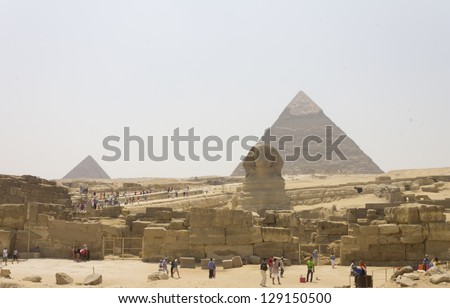 The front of the great Sphinx and the pyramid of Khafre and Menkaure behind it