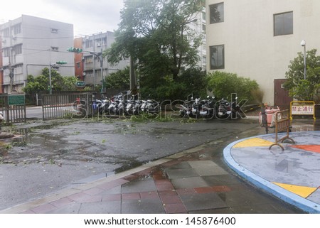 TAIPEI, TAIWAN - JULY 14: Typhoon Soulik hit Taipei city, Taiwan, between July 13th and 14th 2013 causing severe damage. The day after branches, fallen trees and rubbish can be seen on the streets.
