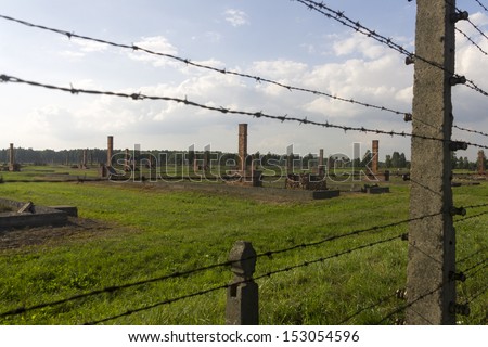 AUSCHWITZ, POLAND - AUGUST 24: The outdoors and barbed wire fence of the infamous Auschwitz II-Birkenau, a former Nazi extermination camp and now a museum on August 24, 2013 in Oswiecim, Poland