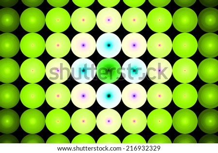 Detailed green abstract background in high resolution with a detailed ornamental pattern of discs in rows and columns and with spirals inside them. Spirals in the center are in cyan, purple and pink