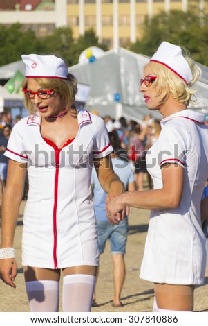 PRAGUE - AUGUST 15, 2015: Two men dressed as sexy female nurses at Letna park on the fifth Gay Prague Pride 2015