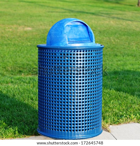 Blue Trash Can in park