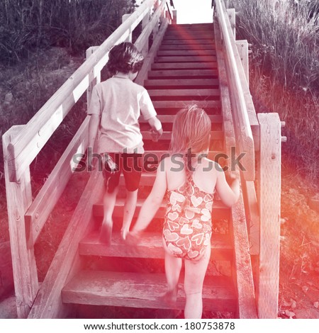 Two kids going up stairs at beach - Instagram effect