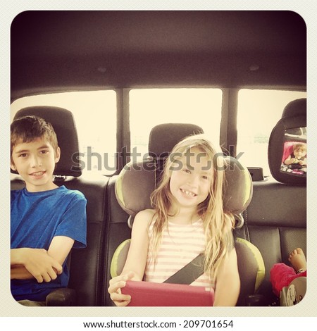 Kids in back of truck going on a trip - With Instagram effect