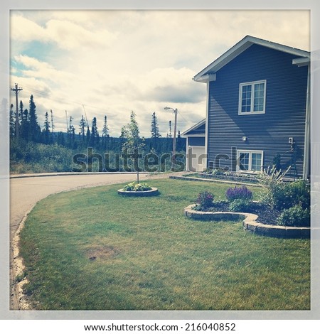 Beautiful house on corner lot with nice lawn and flowers - Instagram effect