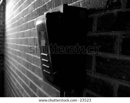 Industrial power box on a brick wall, black and white