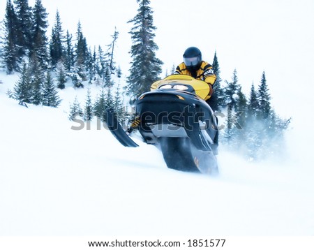 High Key Snowmobile taken a Jump in Snow