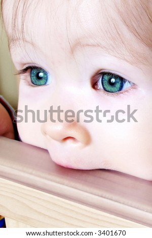 Rainy's 28th Hunger Games Characters Stock-photo-little-baby-biting-on-crib-taken-closeup-with-green-eyes-3401670