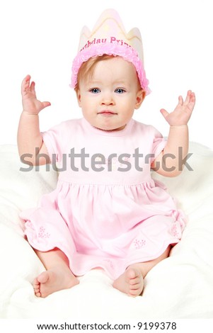 Little Baby Girl in Pink dress and birthday hat and hands in air