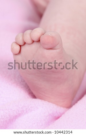 babies foot taken closeup on black background