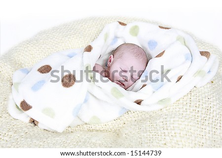 Newborn Baby sleeping in blanket taken closeup 8 days old