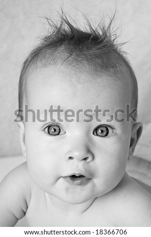 Little Baby Girl with hair stuck up taken closeup - black and white