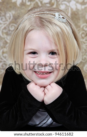 Cute little girl in studio posing for the camera